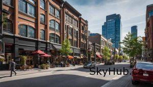 Urban street in Ontario with brick commercial real estate, bustling sidewalks, and modern skyscrapers